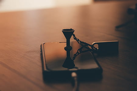 Post-2017 Space Gray Iphone on Brown Wooden Table Close-up Photo thumbnail