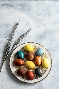 flat lay photo of decorative eggs on plate thumbnail