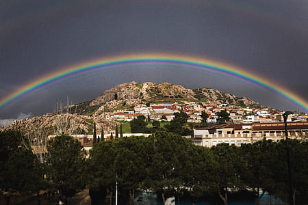 Landscape Photo of the View of City With Rainbow Above thumbnail