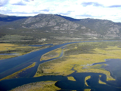 aerial photography of mountain and river thumbnail