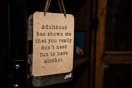 Brown Wooden Signage Hanged on Door thumbnail