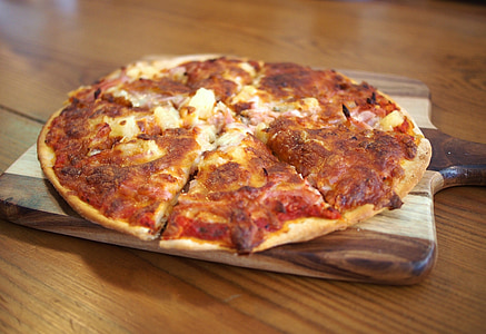 pizza on wooden board thumbnail