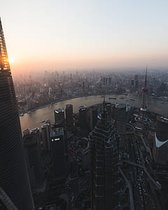aerial photography of city near body of water thumbnail
