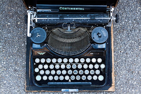 top-view photography of black Continental typewriter thumbnail