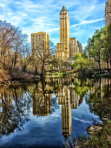 beige and green building near water thumbnail