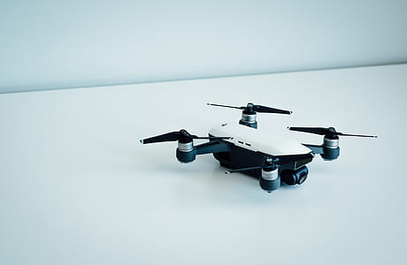 white and black drone on white floor thumbnail