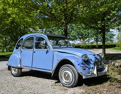 blue 5-door hatchback parked near trees at daytime thumbnail