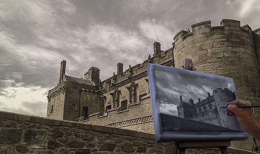 person making sketch of brown concrete castle thumbnail