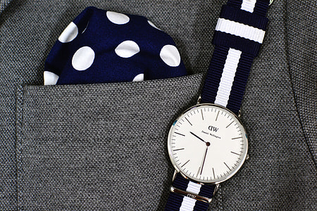 round silver framed analog watch with black and white strap thumbnail