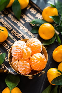 closeup photo of orange fruits on gray bowl thumbnail
