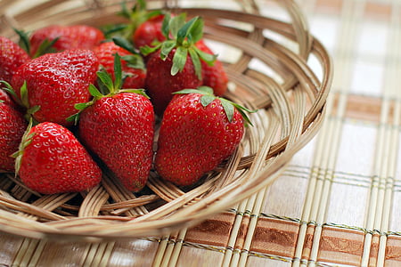 red strawberries in brown wicker basket thumbnail