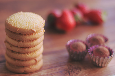 brown cookies and cupcakes on table thumbnail