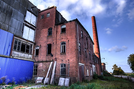 red factory building during daytime thumbnail