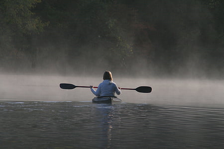 person in white jacket using a boat thumbnail