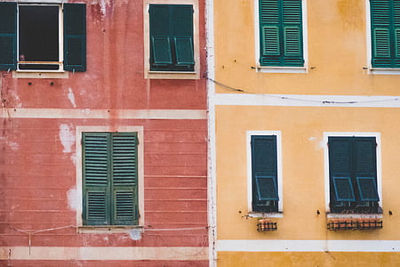 selective focus photography of red and orange concrete building thumbnail