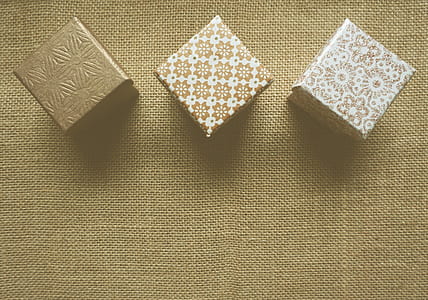 gold-and-white paper weight thumbnail
