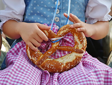 girl holding pretzel thumbnail