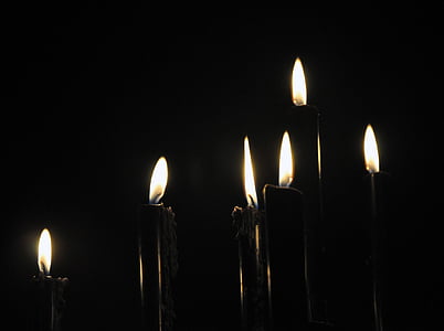 candle lighted on dark room thumbnail