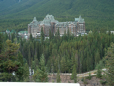 Banff Springs Hotel in the trees in Banff National Park, Alberta, Canada thumbnail