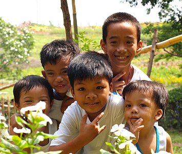 children standing beside plants thumbnail
