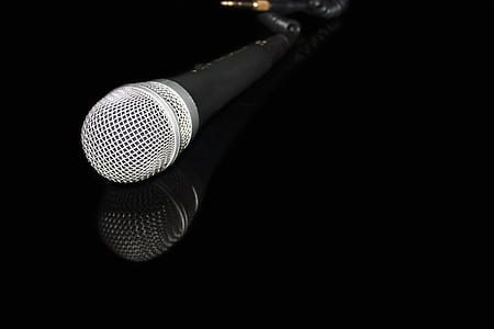 black and gray microphone on black surface thumbnail