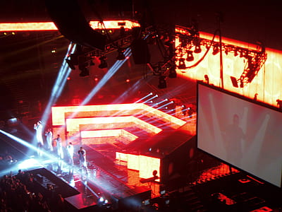 five person standing on stage fronting people thumbnail