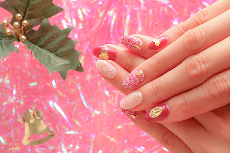 person with pink and red manicure thumbnail