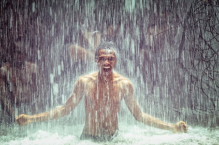 man under body of water during daytime thumbnail