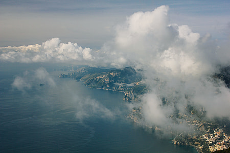 white clouds covering mountain thumbnail