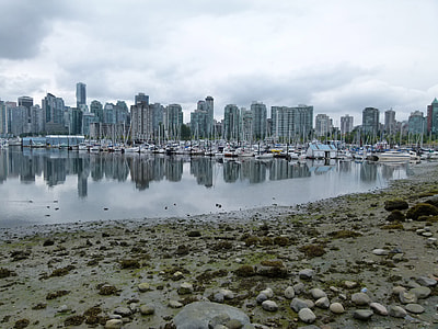 Skyline of Vancouver across the water with boats in British Columbia, Canada thumbnail