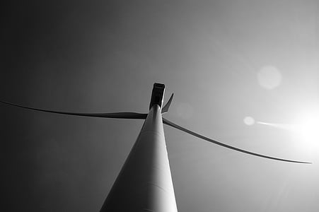 worm's-eye view of wind turbine under clear sky thumbnail