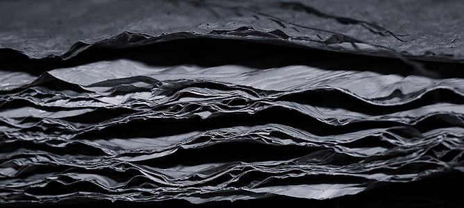 closeup photo of gray and black sheet lot thumbnail