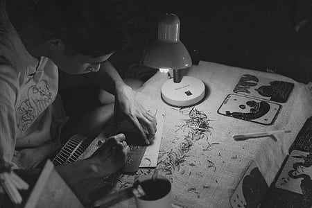 person carving plate on table thumbnail