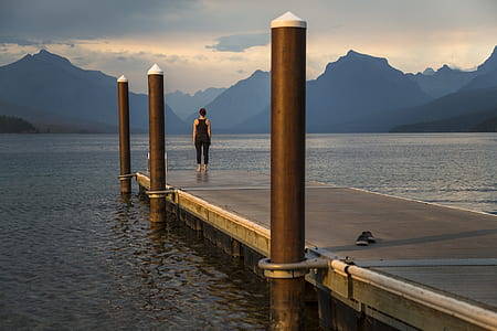woman standing in front of body of water thumbnail