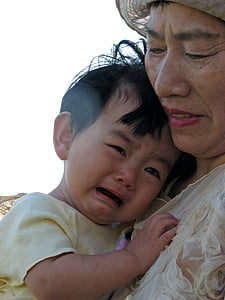 woman holding boy thumbnail