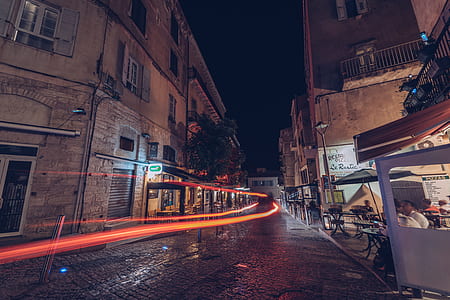 time lapse photography of gray concrete road during nighttime thumbnail