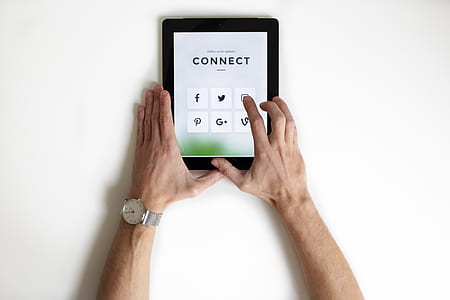 person holding black tablet computer thumbnail