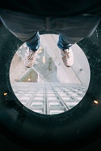 person standing on glass surface thumbnail