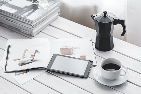 Coffee on a table with other items thumbnail