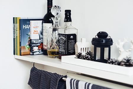 photo of liquor bottles on white shelf thumbnail