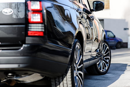 black Ford SUV on road thumbnail