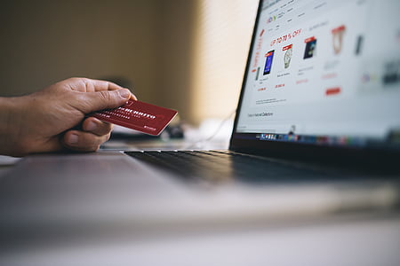 person holding red cart thumbnail