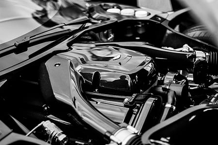 grayscale photography of vehicle engine bay thumbnail