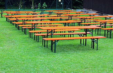 brown-and-black table with bench lot on grass field thumbnail