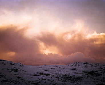 snow covered mountain under white clouds at daytime thumbnail
