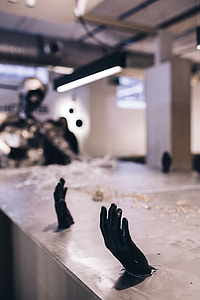 Metal figures by a table full of metal shavings thumbnail