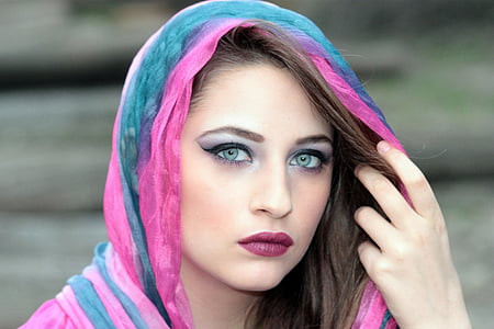 woman wears blue and pink head scarf thumbnail