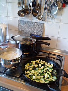 three black cook pots on grey gas burner stove thumbnail