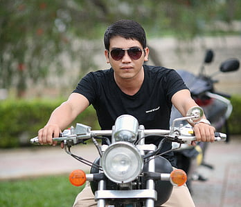 man wearing shades and riding on motorcycle thumbnail