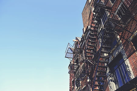 black steel stairs on brown houses thumbnail